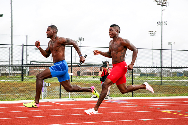 Justin Gatlin and Marvin Bracy practicing relay baton handoffs. 