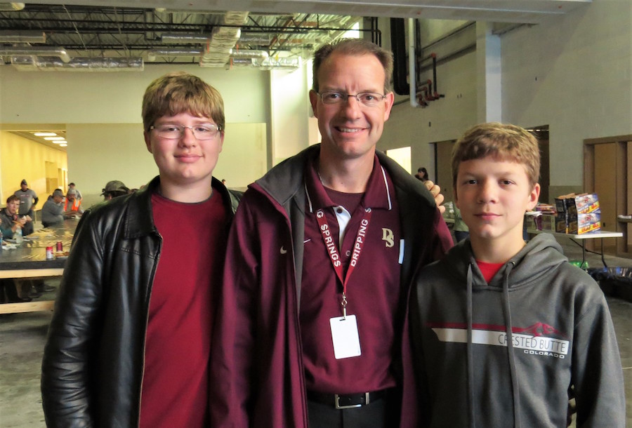 Dripping Springs Superintendent Dr. Bruice Gearing and his sons Christopher and Dominic at the Toys for Tots drive December 16th at the new school location.