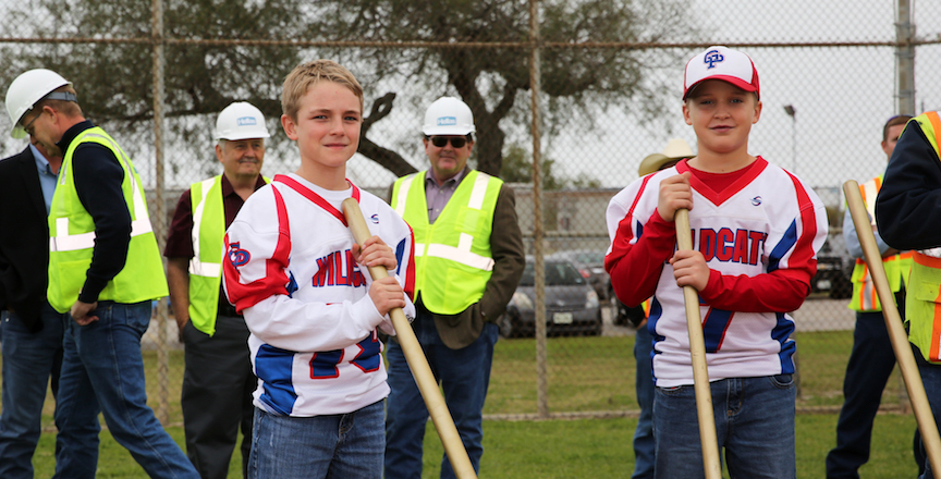 Portland Little League players posing with shovels for the groundbreaking of the baseball and and football field renovations.