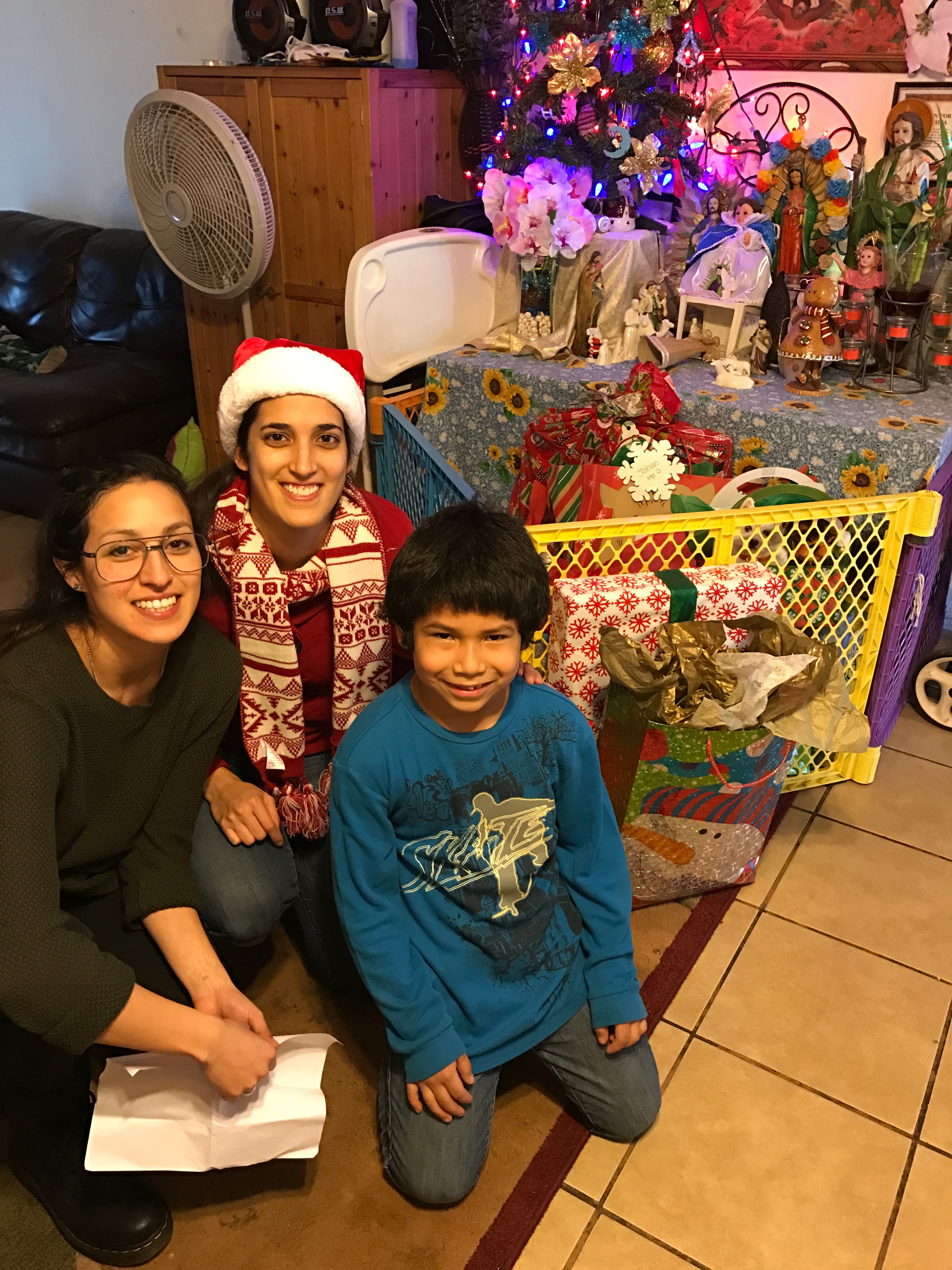 Rocio Rangel and Zaide Viesca with Yimmer, one of the kids that received generous donations from Hellas employees for Christmas through the Blue Santa program.