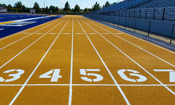 The gold epiQ Track S200 track system installed by Hellas at Tupelo High School in Tupelo, MS.