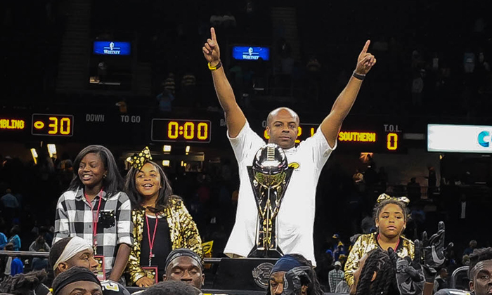 Head Coach Broderick Fobbs with Bayou Classic trophy at the Mercedes Benz Superdome. Grambling State beat Southern University 30-21, clinching the SWAC Western Division title Nov. 25. 