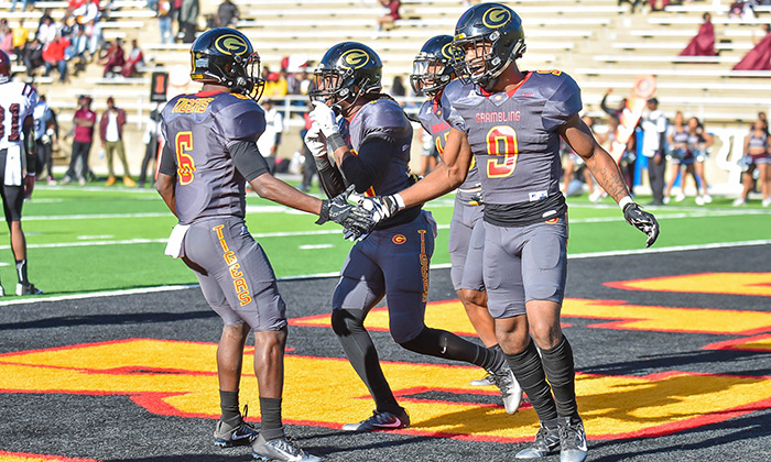 Grambling Players celebrating on home field at Eddie G. Robinson Memorial Stadium where Hellas installed Matrix Turf this summer.