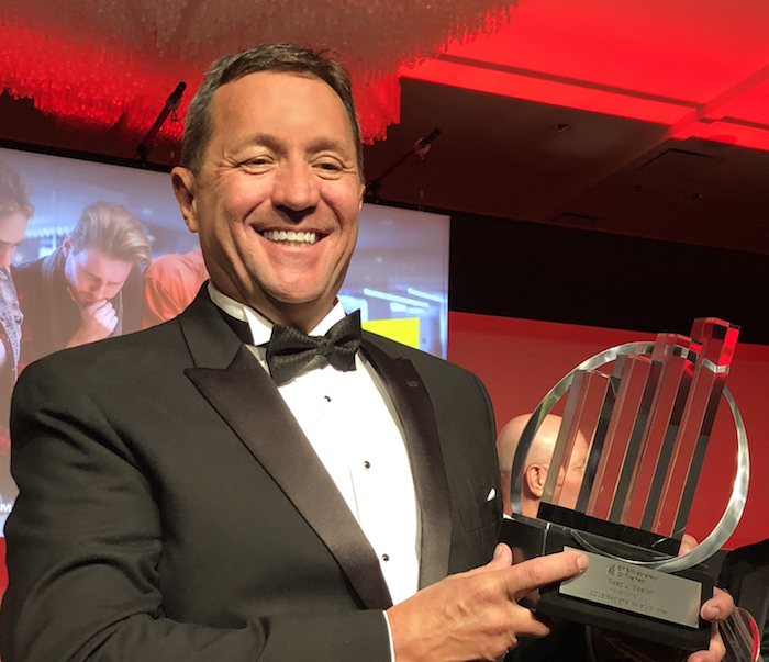 Hellas Construction President and CEO Reed J. Seaton with the Entrepreneur Of The Year 2018 Central Texas award he received June 8 in Austin. 